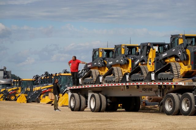 Construction equipment manufactured by John Deere is loaded onto trucks at the John Deere Dubuque Works facility on October 15, 2021 in Dubuque, Iowa
