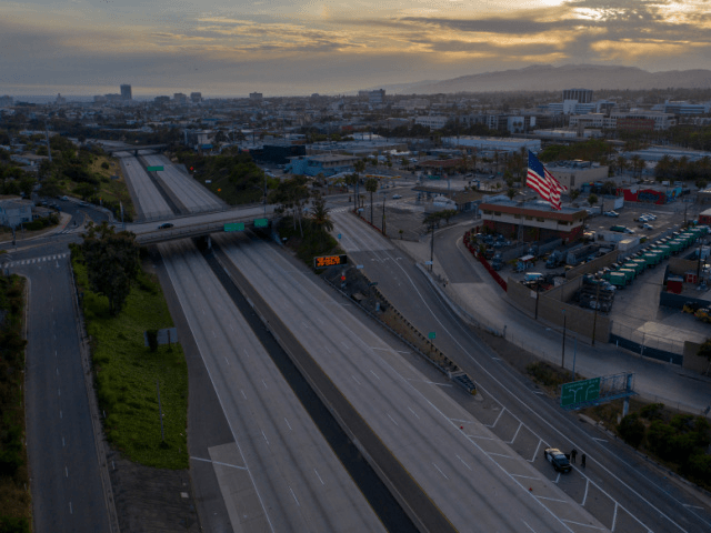 SANTA MONICA, CALIFORNIA - MAY 31: A drone aerial view shows an empty Interstate 10 freeway after all westbound traffic toward Santa Monica was shut down due to rioting and an emergency curfew during demonstrations on May 31, 2020 Santa Monica, California. The vast majority of protesters demonstrated peacefully. Former …