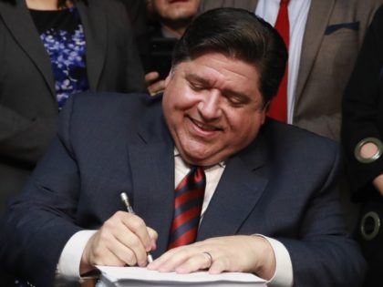 Gov. J.B. Pritzker signs the state budget and legislation related to a graduated income tax in Illinois, during a bill signing Wednesday, June 5, 2019 at the Thompson Center in downtown Chicago.