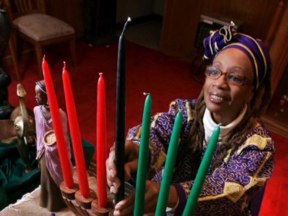 Ruth Ndiagne Dorsey is pictured with a Kwanzaa setting set up for a media photo at her church, The Shrine of the Black Madonna, in Atlanta, Tuesday Dec. 8, 2009.