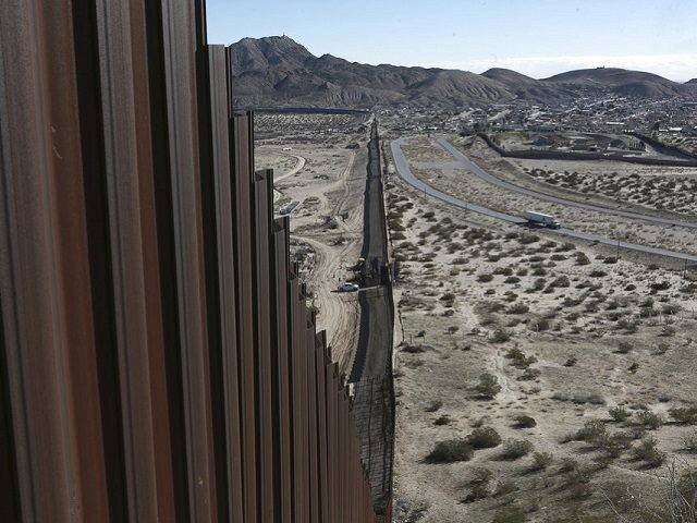 This photo shows a truck driving near the Mexico-US border fence, on the Mexican side, sep