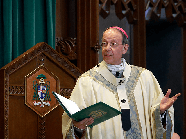 In this March 28, 2017, file photo, Baltimore Archbishop William Lori leads a funeral Mass in Baltimore. On Wednesday, June 5, 2019, Lori released a report on an investigation into former Roman Catholic Bishop Michael Bransfield, in West Virginia, that found a "consistent pattern" of sexual innuendo and suggestive comments and actions toward subordinates. (AP Photo/Patrick Semansky, File)