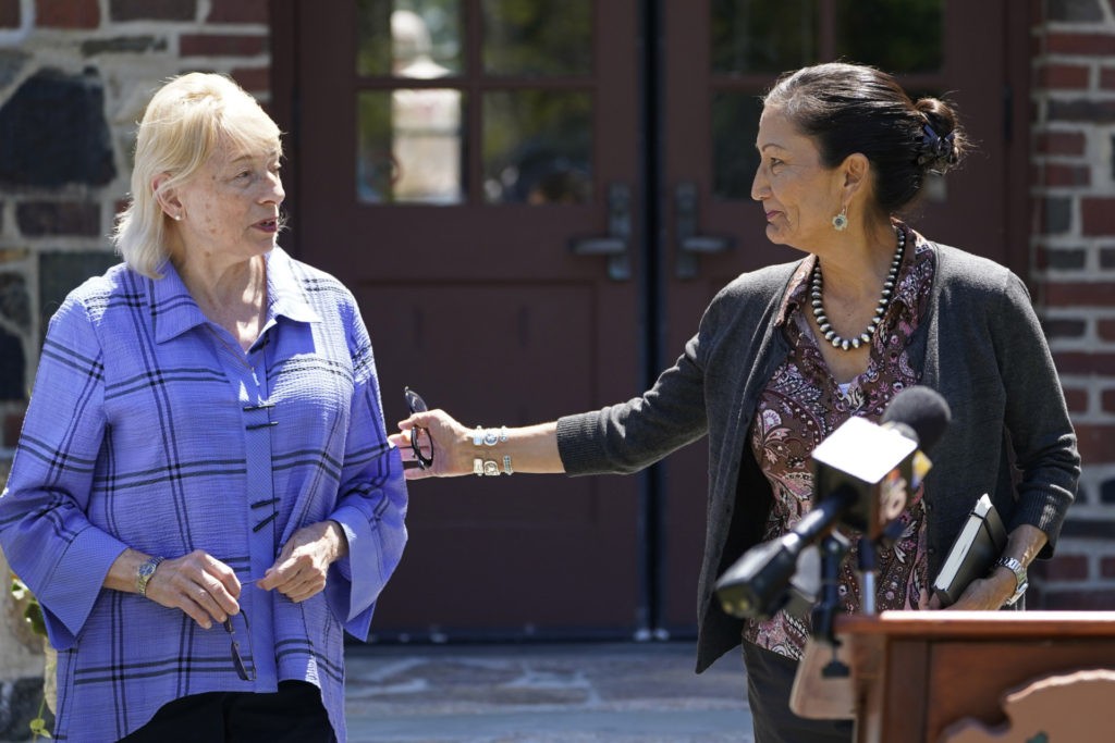 Gov. Janet Mills, left, is greeted by Interior Secretary Deb Haaland, at a news conference at Acadia National Park, Friday, June 18, 2021, in Winter Harbor, Maine(AP Photo/Robert F. Bukaty)