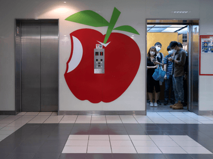 In this Monday, April 26, 2021, file photo, a huge logo of Apple Daily is seen at the lift