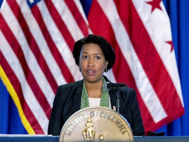 FILE - Washington Mayor Muriel Bowser speaks at a news conference March 15, 2021, in Washington. The District of Columbia will lift its indoor mask requirement starting next week, as local COVID infection cases continue to trend downward. Starting Monday, Nov. 22, masks will no longer be required in many …