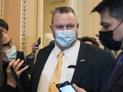 Sen. Jon Tester (D-MT) speaks with reporters, Tuesday, Nov. 16, 2021, on Capitol Hill in Washington.