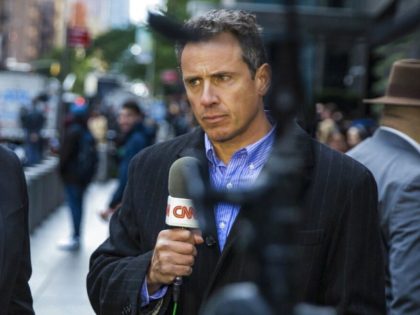 FILE - CNN correspondent Chris Cuomo during on air report in front of the Time Warner Building, where NYPD personnel removed an explosive device Wednesday, Oct. 24, 2018, in New York. CNN fired Cuomo for the role he played in defense of his brother, former Gov. Andrew Cuomo, as he …