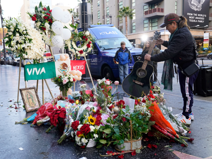Gabriel Akxup, of Los Angeles, a native of Guadalajara, Mexico, lays down his guitar on a shrine for the late Mexican musician Vicente Fernandez on his star on the Hollywood Walk of Fame, Monday, Dec. 13, 2021, in Los Angeles. Fernandez, an iconic and beloved singer of regional Mexican music …