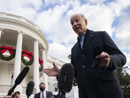 President Joe Biden talks to reporters before boarding Marine One for a trip to visit areas impacted by tornado damage, Wednesday, Dec. 15, 2021, in Washington. (AP Photo/Evan Vucci)