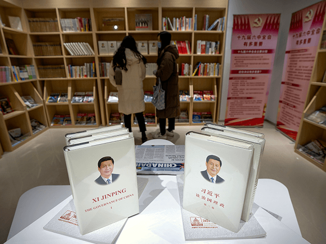 Copies of the book "The Governance of China" by Chinese President Xi Jinping are display i