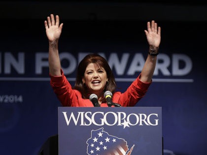 Wisconsin Lieutenant Gov. Rebecca Kleefisch waves to delegates at the Republican party of Wisconsin State Convention Saturday, May 3, 2014, in Milwaukee. (AP Photo/Jeffrey Phelps)