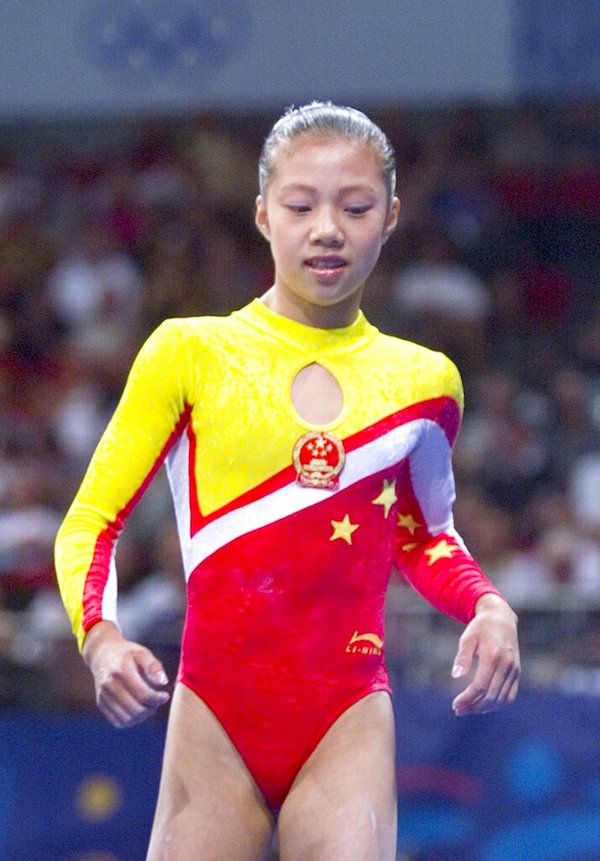 In this Sept. 24, 2000 file photo, Chinese gymnasts Dong Fangxiao comes off the mats following a vault during the women's gymnastic vault finals at the 2000 Summer Olympic Games in Sydney. China was stripped of a bronze medal from the 2000 Sydney Olympics on Wednesday, April 28, 2010, for fielding an underage female gymnast, with the women's team medal now going to the United States. The International Olympic Committee acted after investigations by the sport's governing body determined that Dong Fangxiao was only 14 at the 2000 Games. Gymnasts must turn 16 during the Olympic year to be eligible. (AP Photo/Amy Sancetta, File)