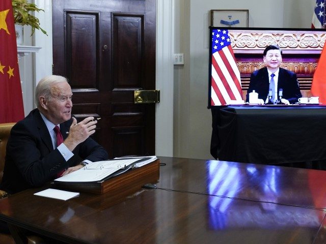 President Joe Biden meets virtually with Chinese President Xi Jinping from the Roosevelt Room of the White House in Washington, Monday, Nov. 15, 2021.