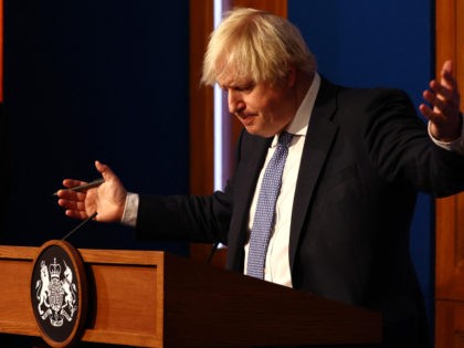 TOPSHOT - Britain's Prime Minister Boris Johnson gestures during a press conference for th