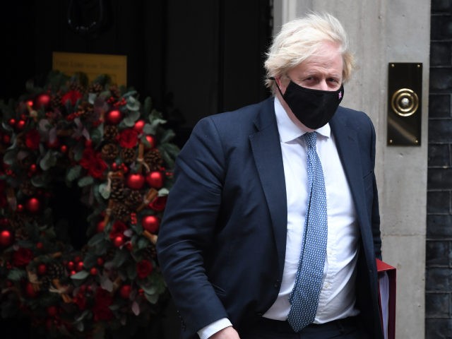 LONDON, ENGLAND - DECEMBER 08: British Prime Minister Boris Johnson leaves Downing Street to attend Prime Minister's Questions on December 7, 2021 in London, England. The prime minister is certain to face questions in parliament today about a Christmas party that allegedly took place inside 10 Downing Street last December. …