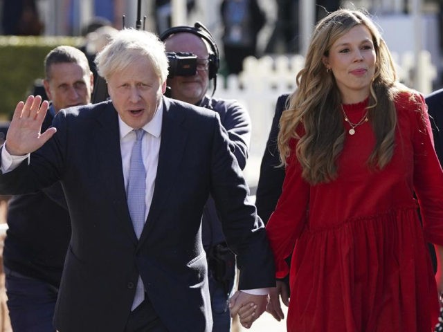 FILE - Britain's Prime Minister Boris Johnson waves to the media s he walks to the convent