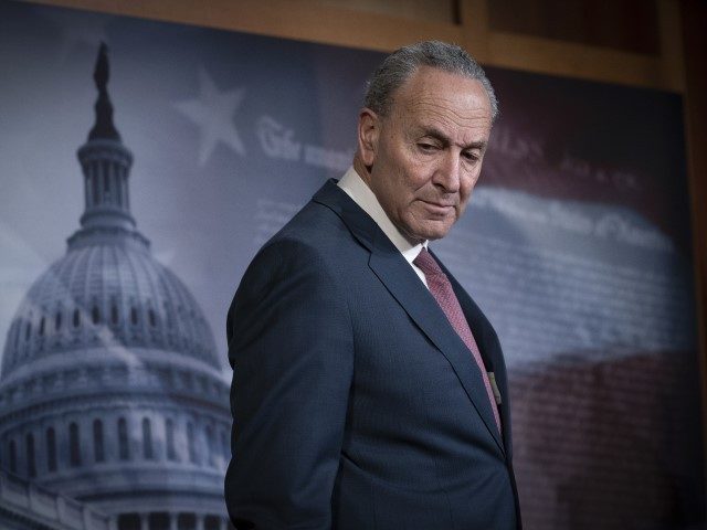Senate Minority Leader Chuck Schumer, D-N.Y., pauses as he speaks to reporters to criticize the process in the Republican-controlled Senate as the impeachment trial of President Donald Trump on charges of abuse of power and obstruction of Congress, resumes in Washington, Friday, Jan. 31, 2020.