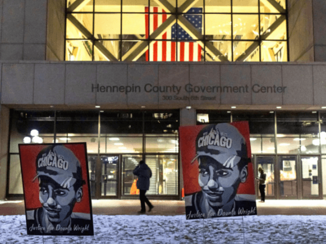 Daunte Wright's images are pictured outside the Hennepin County Courthouse as communi