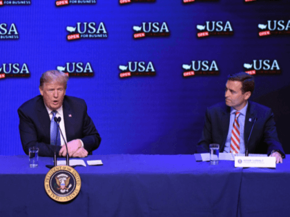 US President Donald Trump flanked by Nevada Senator Dean Heller (L) and Nevada Attorney General Adam Laxalt , speaks during a roundtable discussion on tax reform at the South Point Hotel Casino and Spa in Las Vegas, Nevada, on June 23, 2018. (Photo by Olivier Douliery / AFP) (Photo credit …