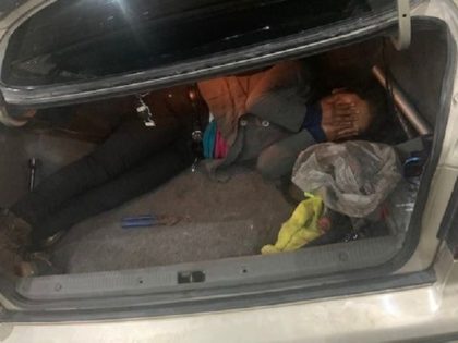 Border Patrol agents find a migrant child locked inside a trunk of a vehicle driven by an armed previously deported human smuggler. (U.S. Border Patrol/Tucson Sector)