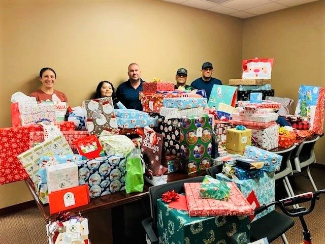 Border Patrol Fallen Agents Fund members deliver Christmas gifts to be delivered to the ch