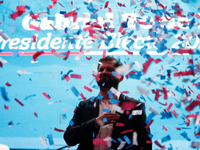 Chile's President elect Gabriel Boric, of the "I approve Dignity" coalition, celebrates hi