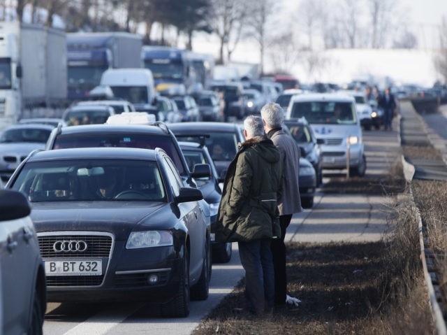 OTTERSRIED, GERMANY - JANUARY 29: Cars stand halted due to a severe accident that had stopped all traffic on the A9 highway on January 29, 2011 near Ottersried, Germany. Winter school vacation has started for several states in northern Germany and led to traffic conjestion on highways heading south. (Photo …