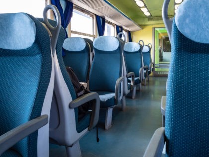 interior of railway passenger car of the second class in the regional train in Lombardy in Italy