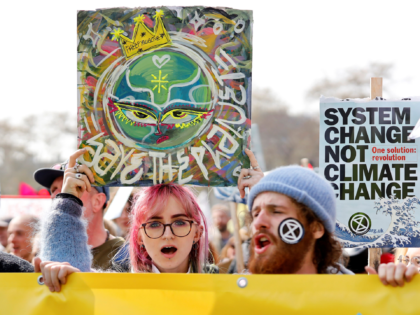 TOPSHOT - Environmental protesters from the Extinction Rebellion group stage a demonstrati