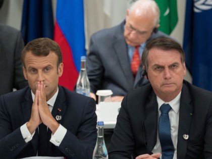 France's President Emmanuel Macron (L) and Brazil's President Jair Bolsonaro attend a meeting on the digital economy at the G20 Summit in Osaka on June 28, 2019. (Photo by Jacques Witt / POOL / AFP) (Photo credit should read JACQUES WITT/AFP via Getty Images)