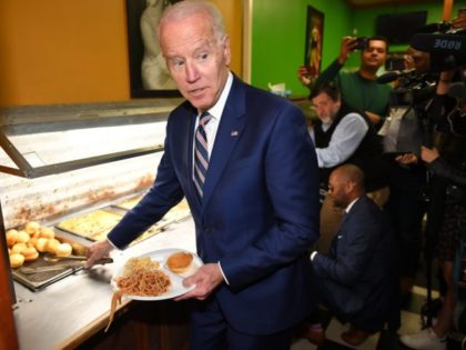 Democratic presidential candidate Joe Biden picks up some lunch at Pearl's Southern Cooking restaurant in Jackson, Mississippi on March 8, 2020. (Photo by MANDEL NGAN / AFP) (Photo by MANDEL NGAN/AFP via Getty Images)