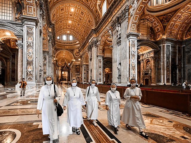 Nuns visit St. Peter's Basilica as it reopens on May 18, 2020 in The Vatican during the lockdown aimed at curbing the spread of the COVID-19 infection, caused by the novel coronavirus. - Saint Peter's Basilica throws its doors open to visitors on May 18, 2020, marking a relative return …