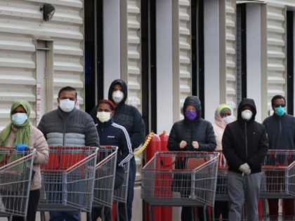 WHEATON, MARYLAND - APRIL 16: Customers wear face masks to prevent the spread of the novel