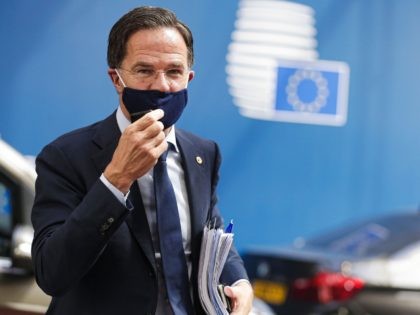 Netherlands' Prime Minister Mark Rutte adjusts his protective face mask, as he arrives for the fourth day of an EU summit at the European Council building in Brussels, on July 20, 2020, as the leaders of the European Union hold their first face-to-face summit over a post-virus economic rescue plan. …
