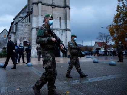 French soldiers of the Sentinelle force patrol in front of the church of Saint-Etienne du Rouvray, northwestern France, during the visit of French Prime Minister Jean Castex to support the French Catholic community on October 31, 2020, two days after a knife attacker killed three people at the Basilica of …