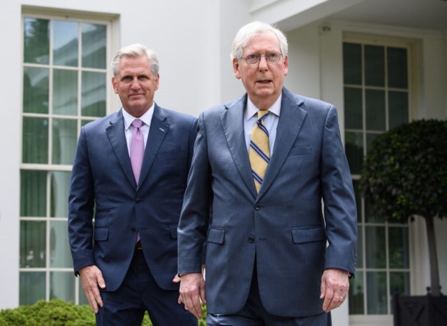 US Senate Minority Leader Mitch McConnell (L) and House Minority Leader Kevin McCarthy arrive to speak to the press following their meeting with US President Joe Biden and Democratic congressional leaders at the White House in Washington, DC, on May 12, 2021. (Photo by Nicholas Kamm / AFP) (Photo by …