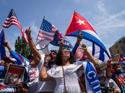 WASHINGTON, DC - JULY 26: Cuban activists and supporters rally outside the Cuban Embassy during a Cuban freedom rally on July 26, 2021 in Washington, DC. Cuban activists and demonstrators held a rally to urge the American government to intervene in Cuba to support human rights and end Communism in …