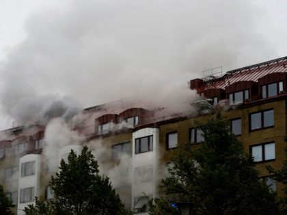 Smoke billows from a building as emergency services fights a fire at the site of an explosion in central Gothenburg on September 28, 2021. - Some 20 people were taken to hospital after an explosion hit a residential building causing a fire affecting several appartments and stairwells in the south …