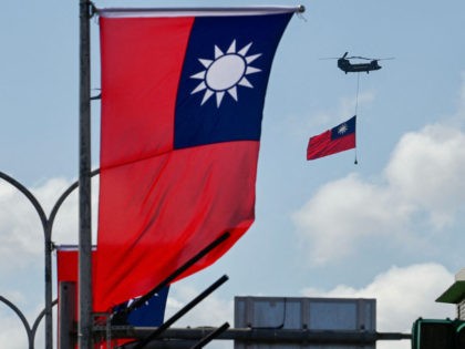 A CH-47 Chinook helicopter carries a Taiwan flag during national day celebrations in Taipe