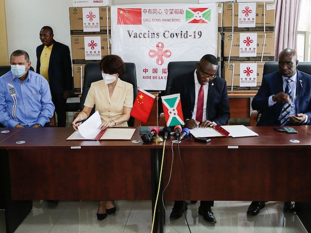 The ambassador of China to Burundi, Zhao Jiang Ping (L), and The Burundi Minister of Health Thadee Ndikumana (R), sign before speaking to journalist about 500,000 donated doses of China's Sinopharm vaccine at a ceremony in the economic capital Bujumbura on October 14, 2021. - Burundi, one of the last countries in the world to inoculate its people against Covid-19, received its first batch of vaccines on October 14, 2021 after a major about-turn by the government. (Photo by tCHANDROU NITANGA / AFP) (Photo by TCHANDROU NITANGA/AFP via Getty Images)