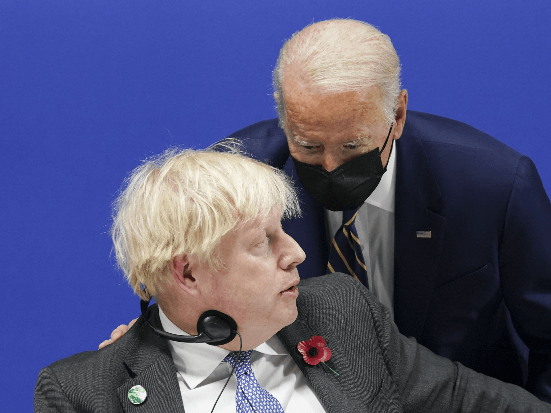Britain's Prime Minister Boris Johnson (L) listens to U.S. President Joe Biden as they attend a meeting focused on action and solidarity at the UN Climate Change Conference (COP26) in Glasgow, on November 1, 2021. - COP26, running from October 31 to November 12, 2021 in Glasgow, will be the biggest climate conference since the 2015 Paris summit and is seen as crucial in setting worldwide emission targets to slow global warming, as well as firming up other key commitments. (Photo by KEVIN LAMARQUE / POOL / AFP) (Photo by KEVIN LAMARQUE/POOL/AFP via Getty Images)