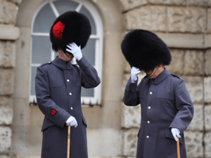 Members of the Coldstream Guards prepare in Horse Guards Parade before attending the Remem