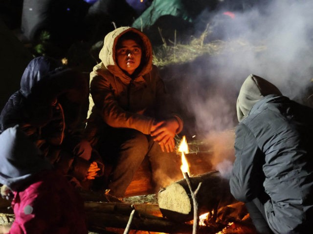 Migrants aiming to cross into Poland camp near the Bruzgi-Kuznica border crossing on the B