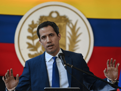 Venezuelan opposition leader Juan Guaido gestures while speaking during a press conference