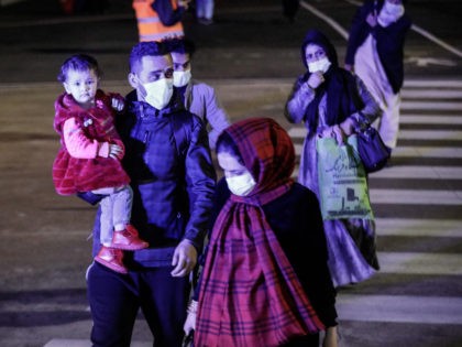 THESSALONIKI, GREECE - NOVEMBER 22: Afghan refugees arrive at Thessaloniki International Airport Makedonia via Kabul on November 22, 2021 in Thessaloniki, Greece. The 118 Afghans included a minister, prosecutor and a US Army translator. Some will remain in Greece for the foreseeable future and others are headed to third countries. …