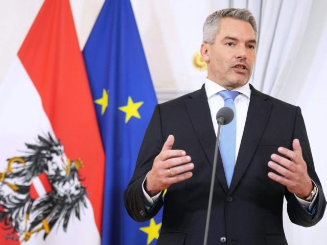 Newly appointed Austria's Chancellor Karl Nehammer gives a press statement during a handover ceremony at the Chancellery in Vienna, Austria on December 6, 2021. - Austria's Interior Minister Karl Nehammer is due to be sworn in as the country's third chancellor in as many months on December 6, capping a …