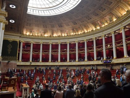 Deputies stand as National Assembly president Richard Ferrand pronounces the funeral orati