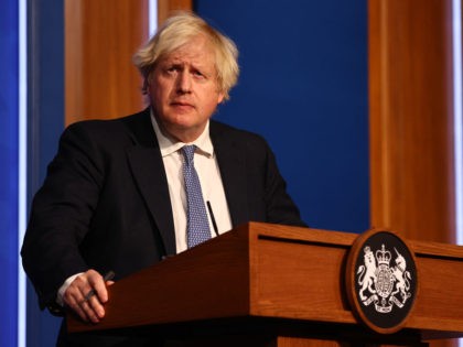 LONDON, ENGLAND - DECEMBER 08: British prime Minister Boris Johnson gives a press conference at 10 Downing Street on December 8, 2021 in London, England. During the press conference, the Prime Minister announced that the government will implement its “Plan B” due to the rapid transmission of the Omicron variant. …