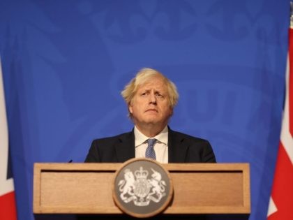 LONDON, ENGLAND - DECEMBER 08: British prime Minister Boris Johnson gives a press conference at 10 Downing Street on December 8, 2021 in London, England. During the press conference, the Prime Minister announced that the government will implement its “Plan B” due to the rapid transmission of the Omicron variant. …
