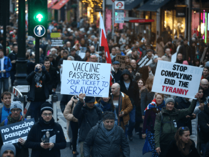 LONDON, ENGLAND - DECEMBER 18: "Freedom march" protestors against vaccines, vaccine passpo